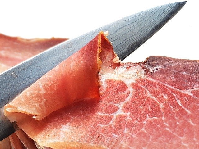 Ham meat being cut