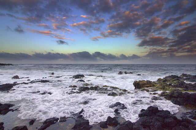 Hawaii sunset rocks and waves