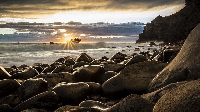 Sunset over the rocks on the beach