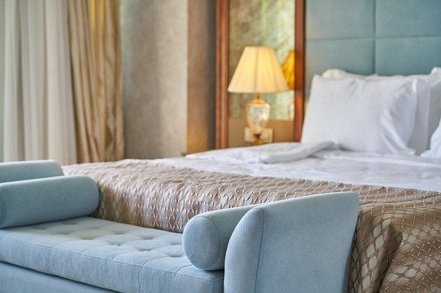Hotel bed and sofa in luxury hotel
