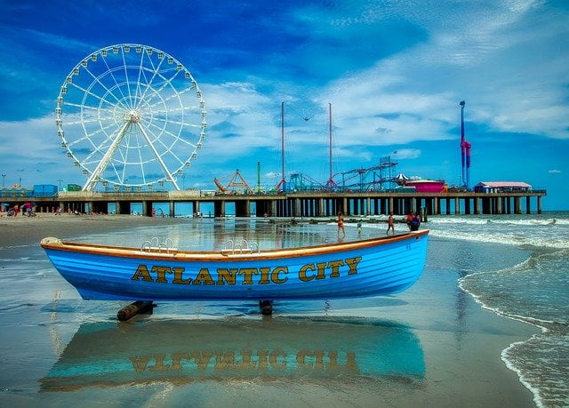 Atlantic City beach with boat and Ferris Wheel in New Jersey, USA