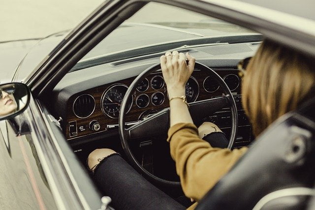Lady driving steering wheel