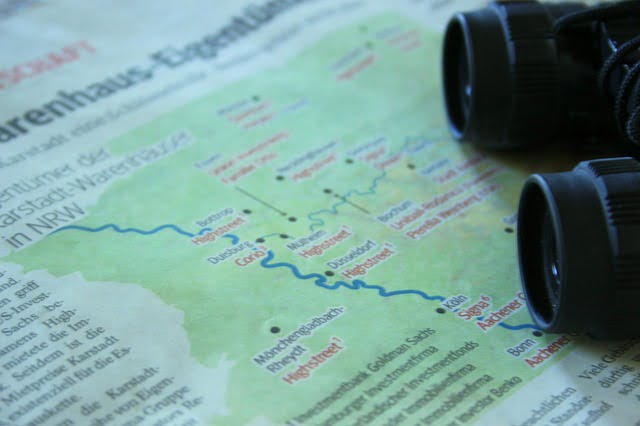 Travel map newspaper with binoculars 
