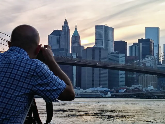 Photographer in NYC taking shots of bridge
