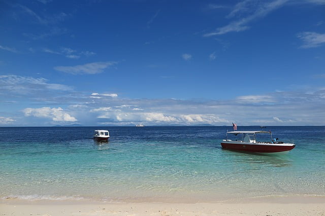 Sipadan beach views with boats in Malaysia