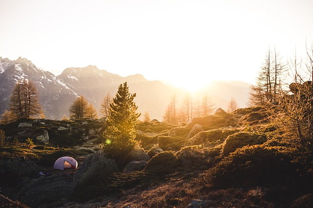 Tent sunset trees and mountain views