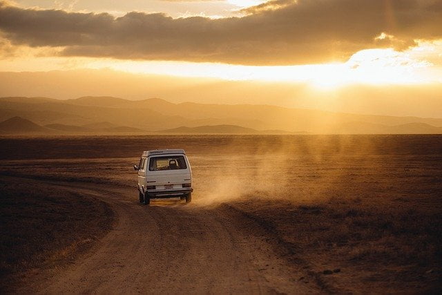 Campervan driving on a dirt road