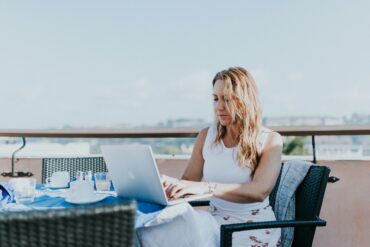 digital nomad working on rooftop