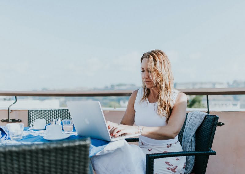 digital nomad working on rooftop